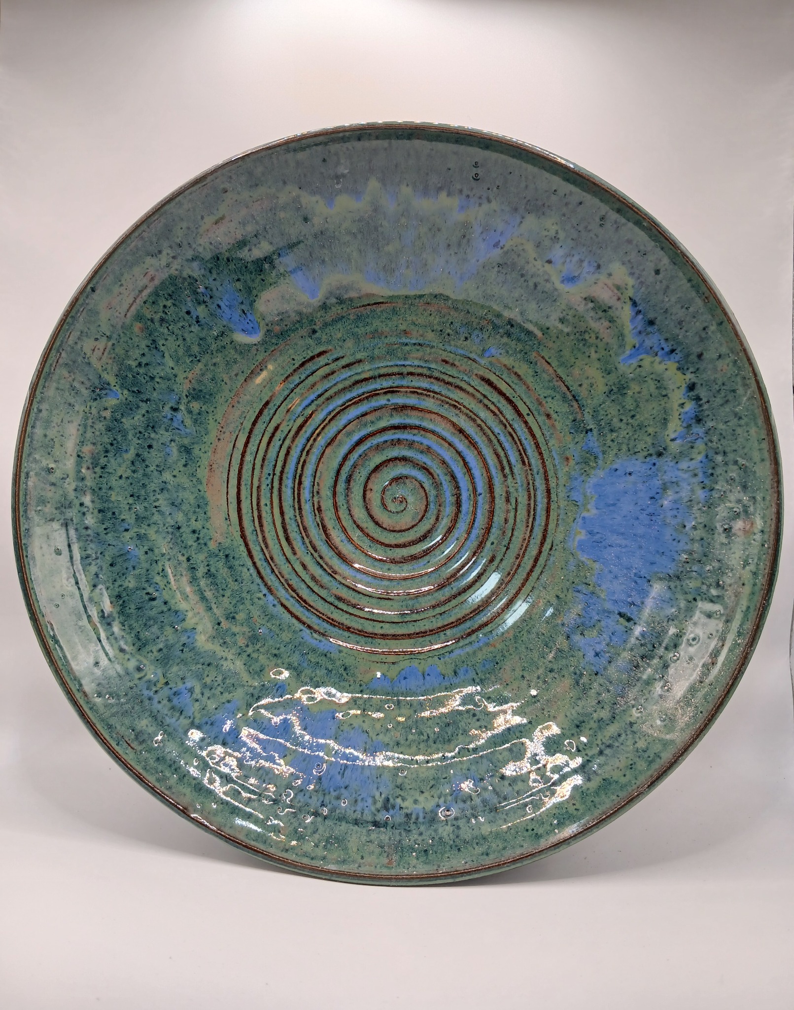 Blue-green handmade ceramic bowl